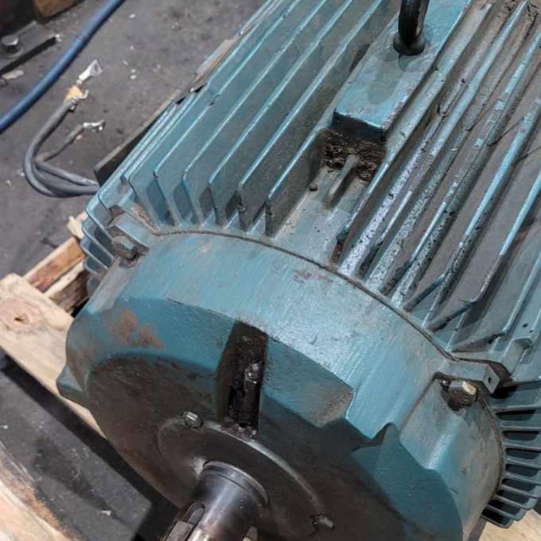 Industrial motors installed along a large machinery unit