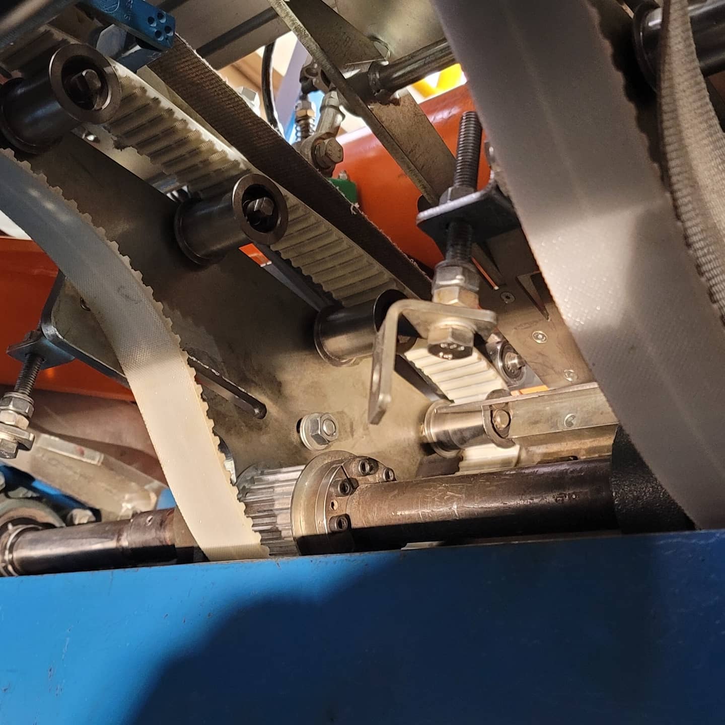 Technician servicing an industrial composer machine
